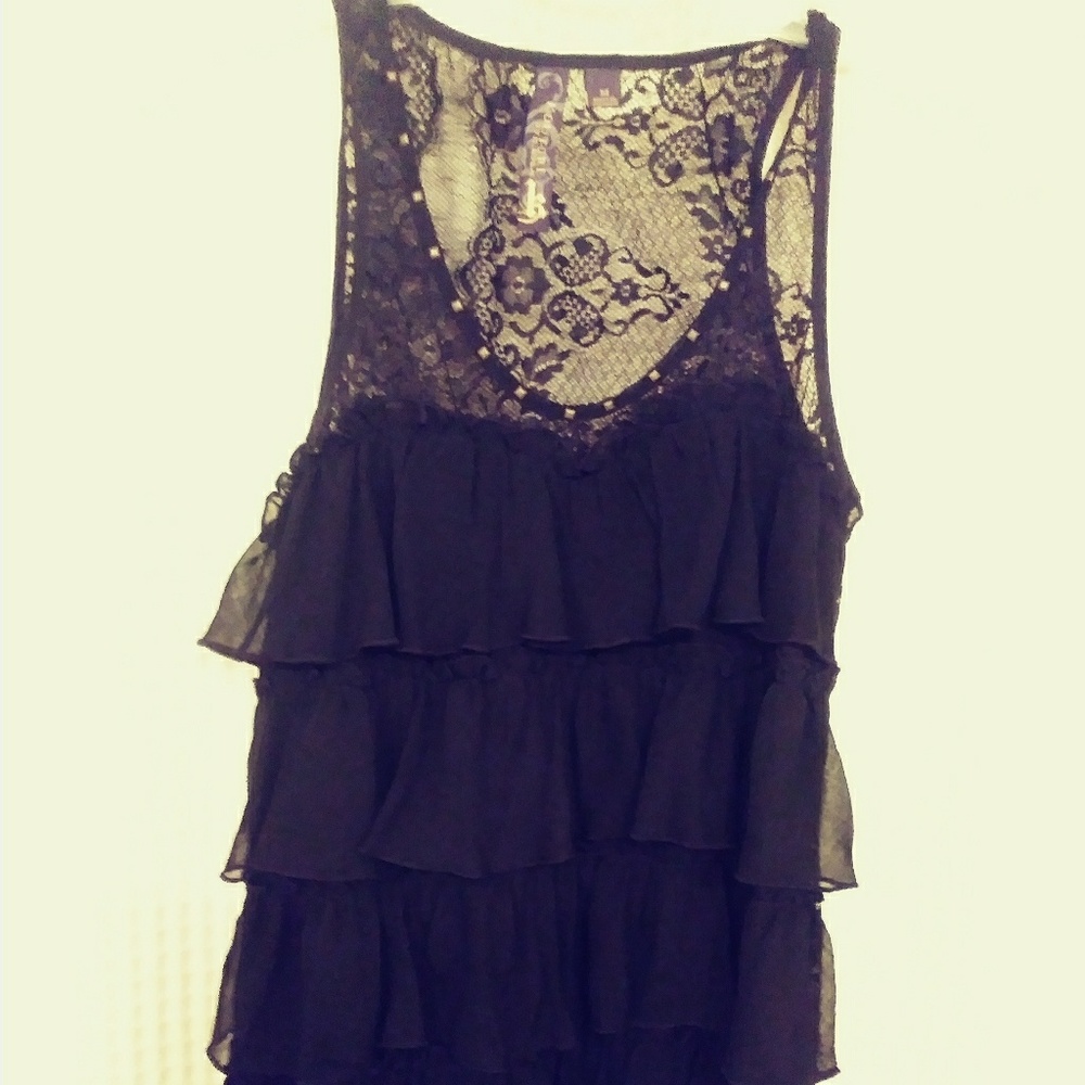 Sleeveless lacey black top.